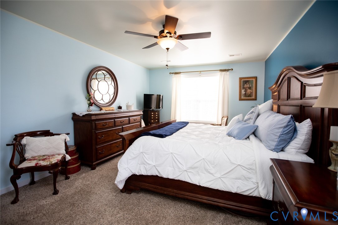 110 Jesse's Way Farmville, VA 23901 - Photo 29 of 56 a bedroom with a bed a dresser and chair