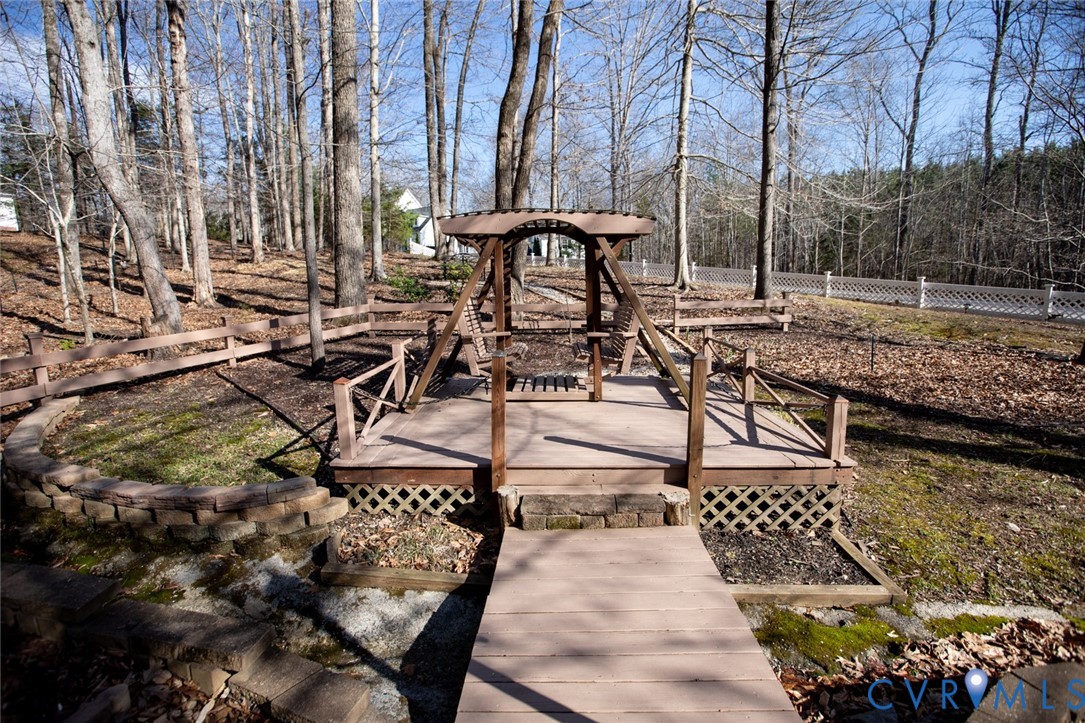 110 Jesse's Way Farmville, VA 23901 - Photo 49 of 56 a view of a patio with table and chairs with wooden floor and fence