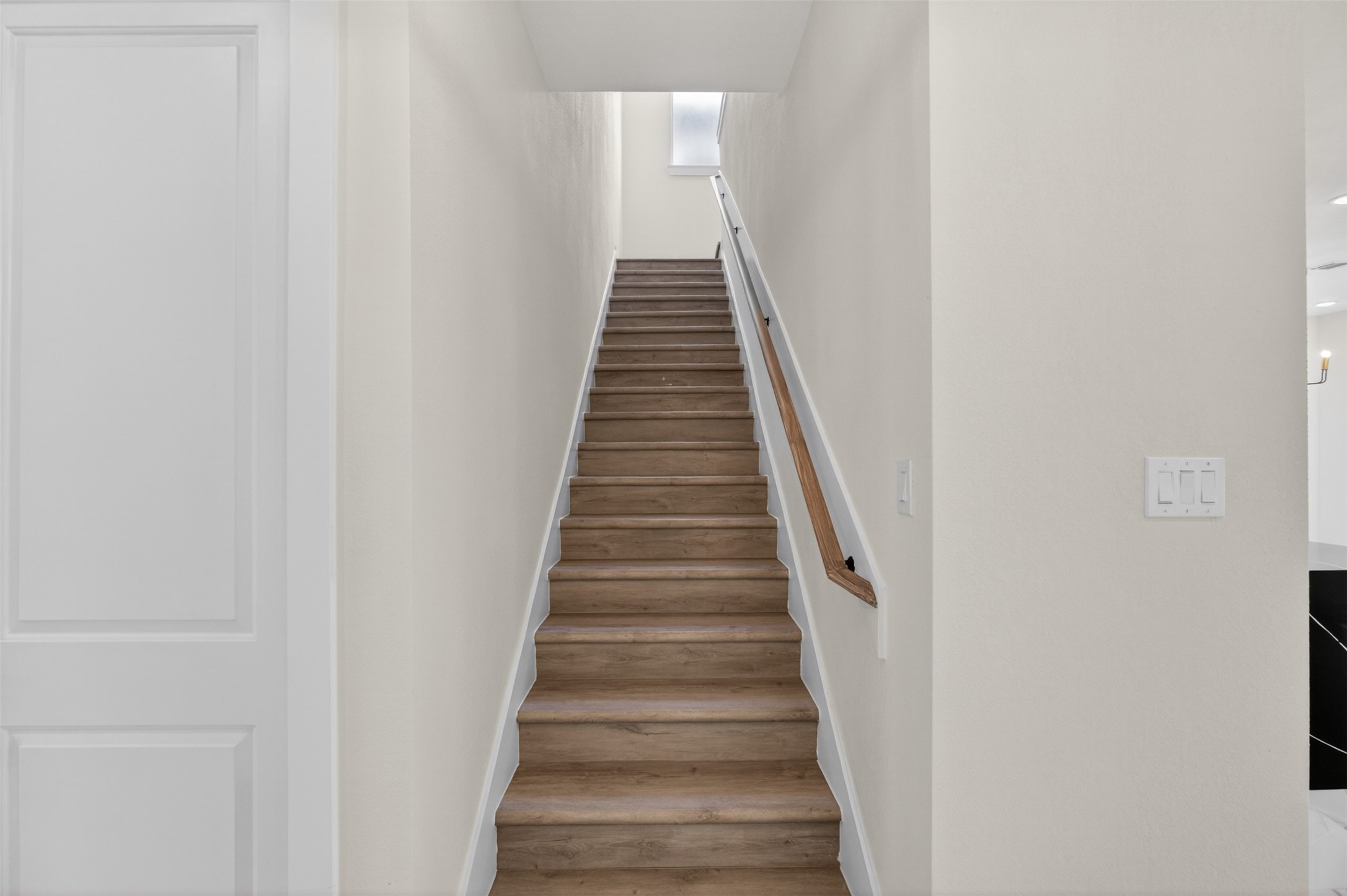 5906 St Augustine Street, Unit F Houston, TX 77021 - Photo 14 of 34 Interior staircase with wood-look treads and clean white walls.
