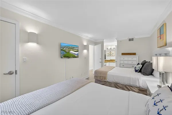 a bedroom with a bed and a couch