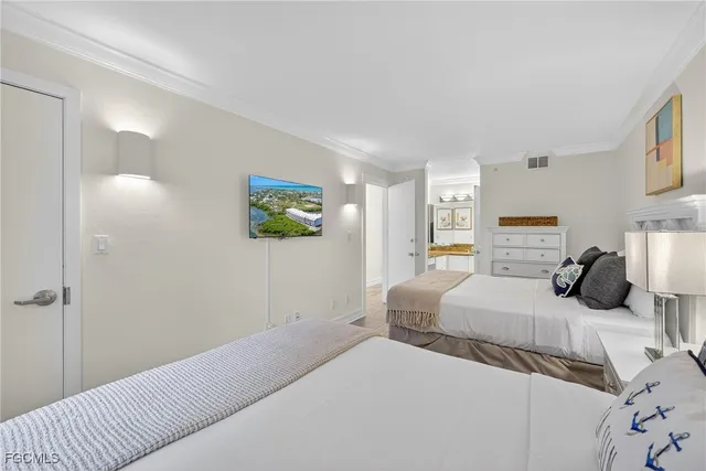 a bedroom with a bed and a couch