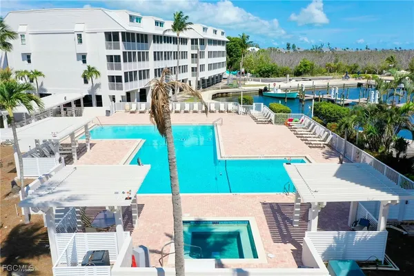 an aerial view of a house with outdoor space and pool view
