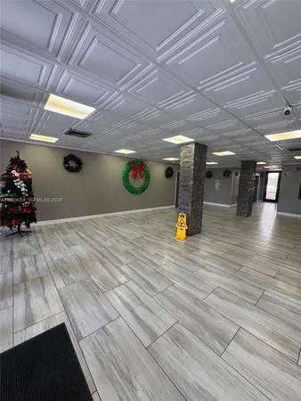 a view of a studio with wooden floor