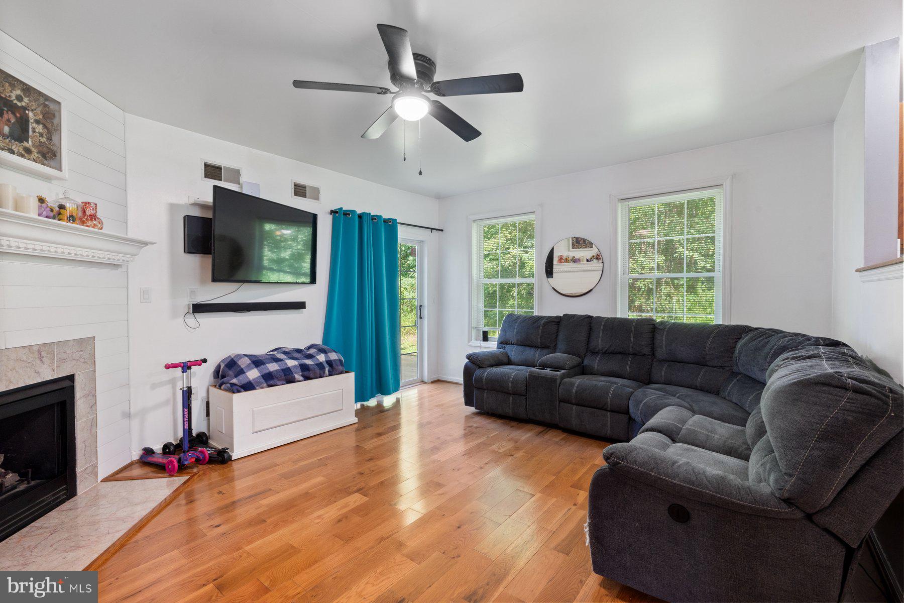 1903 Hain Road New Freedom, PA 17349 - Photo 11 of 40 a living room with furniture fireplace and flat screen tv