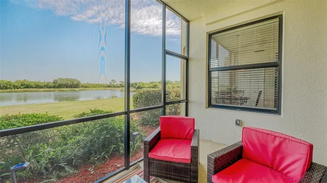 a view of a living room and floor to ceiling window