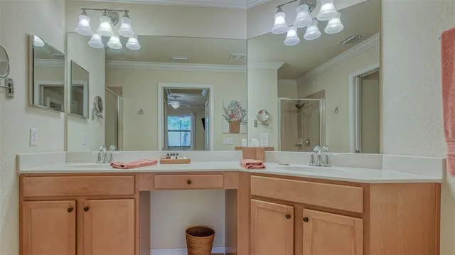 a bathroom with a sink double vanity and a mirror