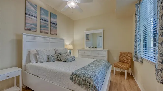 a bedroom with a bed and a chair