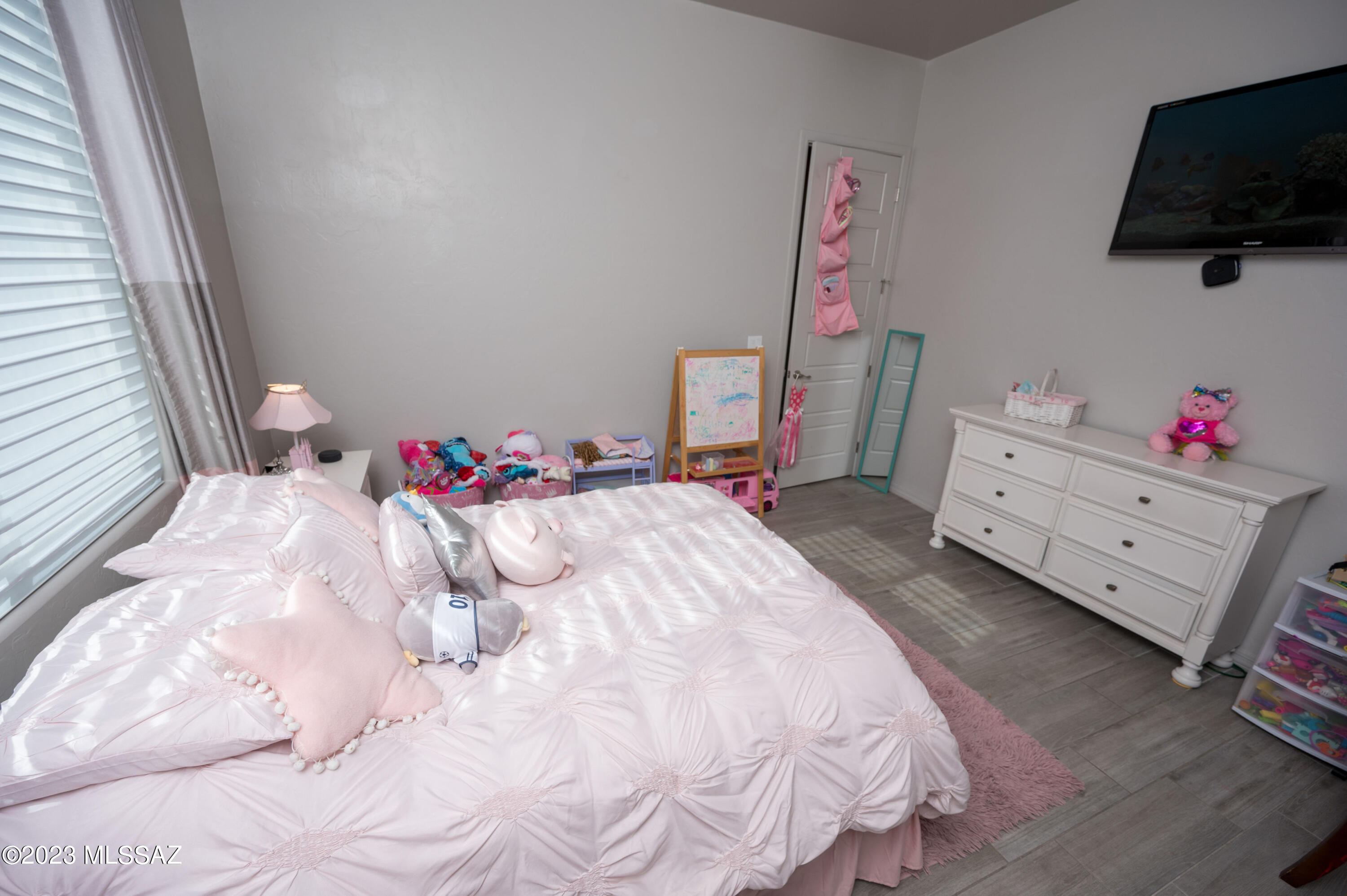 384 Via Estrella Vista Rio Rico, AZ 85648 - Photo 16 of 32 a bed room with a bed and a television