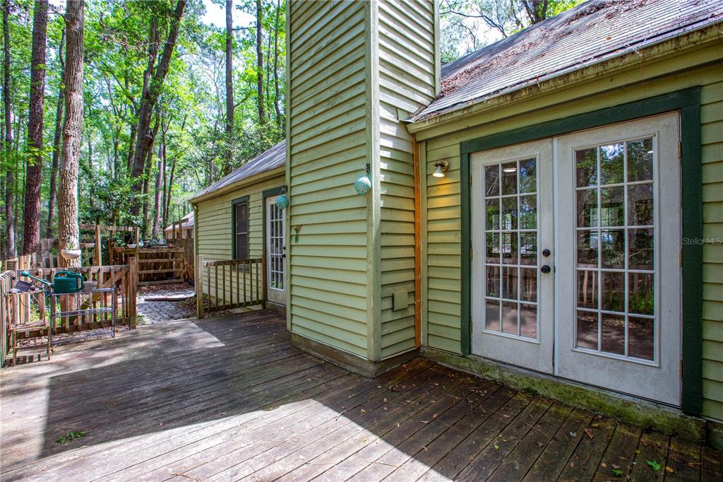 5208 Southwest 86 Terrace Gainesville, FL 32608 - Photo 23 of 26 a view of a house with backyard and deck