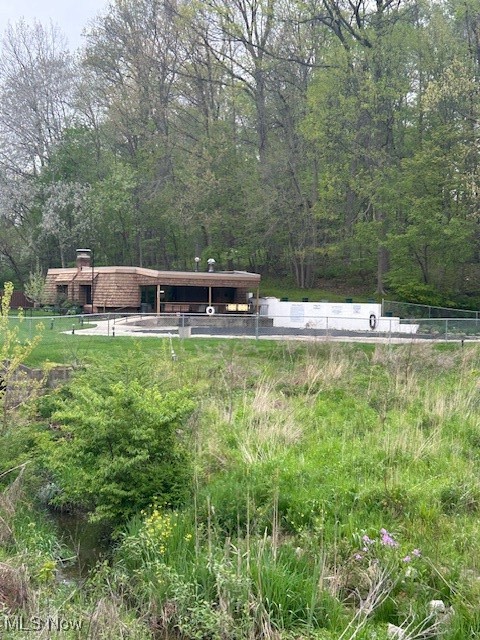3068 Kent Road, Unit 211 Stow, OH 44224 - Photo 24 of 27 View of pool featuring fence and a view of trees