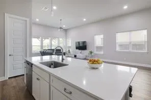 a kitchen that has a sink and a stove