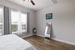 a bedroom with a large bed and a window