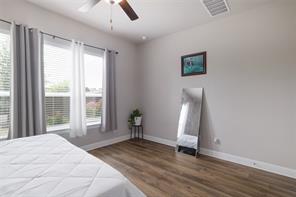 601 C-Bar Ranch Trail, Unit 51 Cedar Park, TX 78613 - Photo 15 of 33 Bedroom with dark wood-style floors and a ceiling fan
