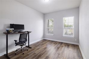 601 C-Bar Ranch Trail, Unit 51 Cedar Park, TX 78613 - Photo 18 of 33 Home office with dark wood-style flooring and baseboards