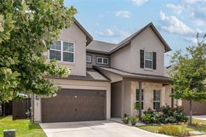 601 C-Bar Ranch Trail, Unit 51 Cedar Park, TX 78613 - Photo 2 of 33 Traditional-style house with driveway, stucco siding, and an attached garage