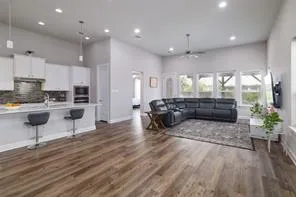 a living room with furniture and a potted plant