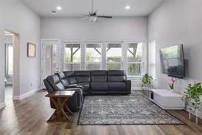 a living room with furniture and a flat screen tv