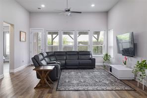 601 C-Bar Ranch Trail, Unit 51 Cedar Park, TX 78613 - Photo 8 of 33 Living area with ceiling fan, a towering ceiling, wood finished floors, and recessed lighting