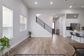a view of an entryway with wooden floor
