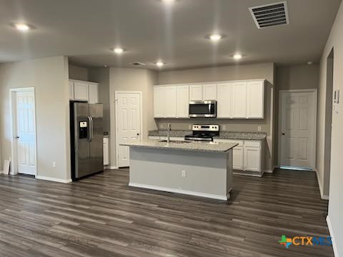 8419 Brahma Plns Road Temple, TX 76502 - Photo 2 of 17 a kitchen with stainless steel appliances a refrigerator and a stove top oven