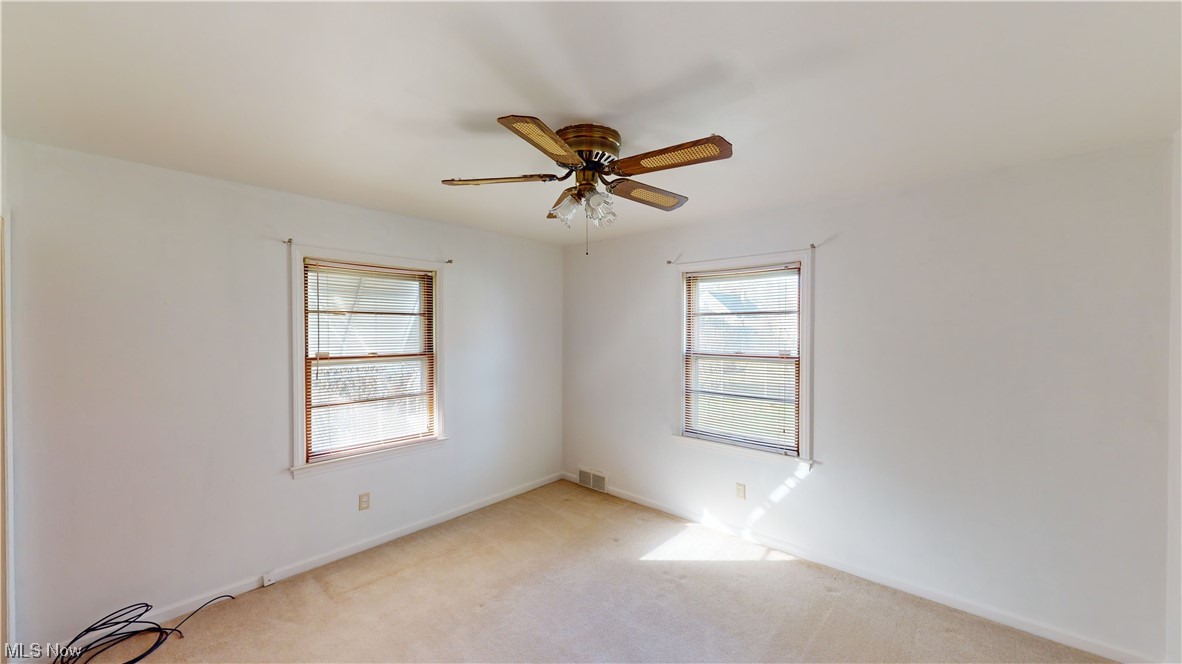 3520 Kirk Road Youngstown, OH 44511 - Photo 17 of 31 Empty room with ceiling fan and light carpet