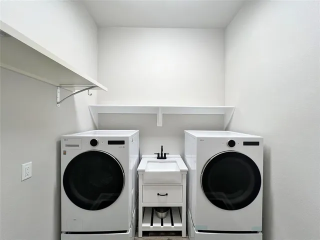 a utility room with dryer and washer