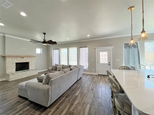 a living room with furniture and a fireplace