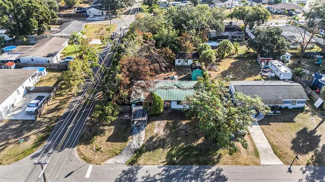 an aerial view of residential houses with outdoor space