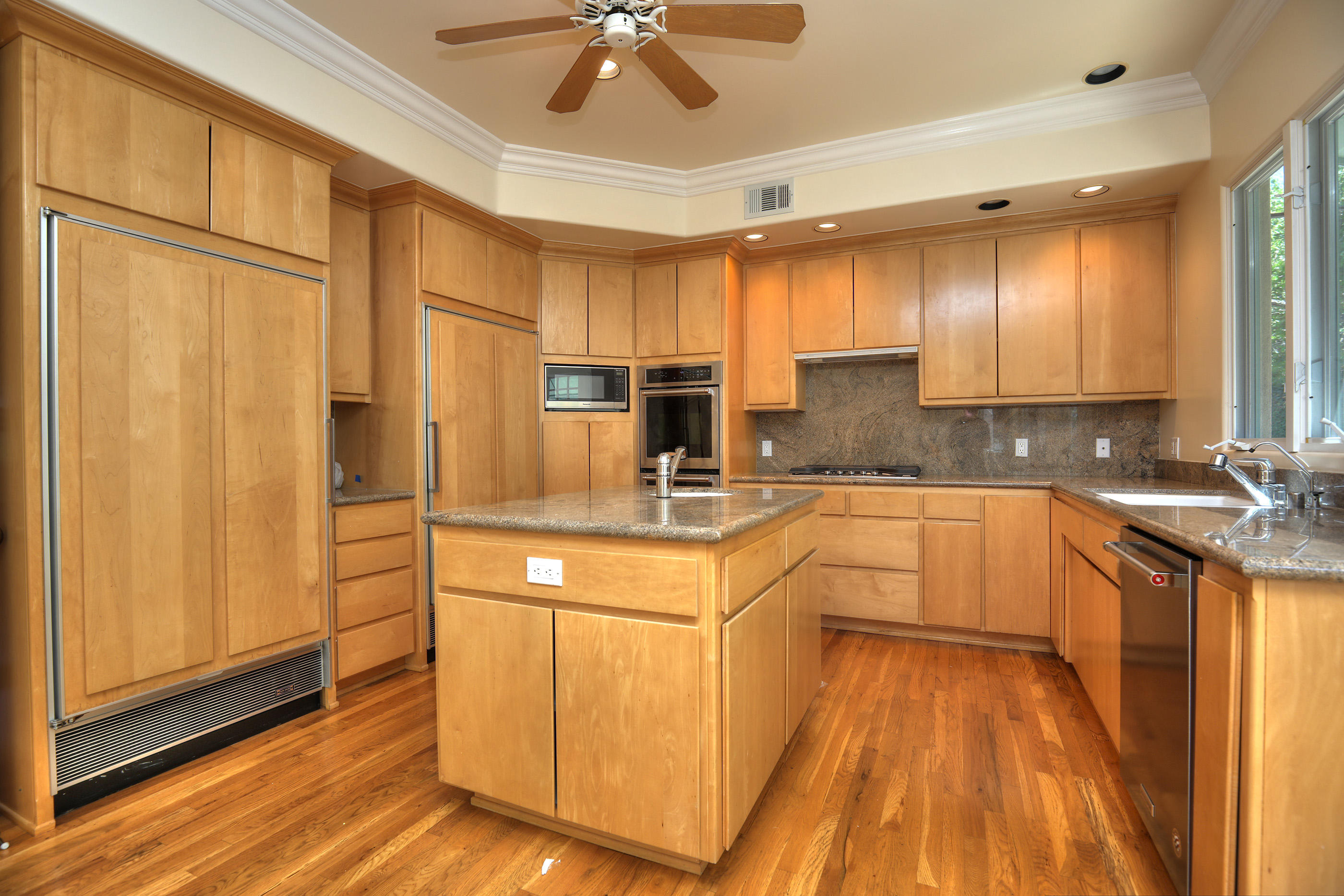 1138 Hill Road Montecito, CA 93108 - Photo 7 of 15 a large kitchen with stainless steel appliances granite countertop a stove a sink dishwasher and a refrigerator with wooden floor