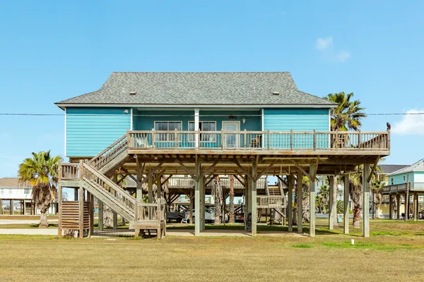 a front view of a house with parking area