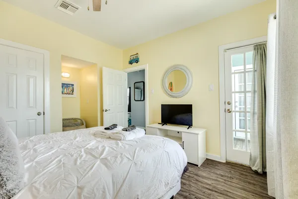 a bedroom with a bed and a chandelier