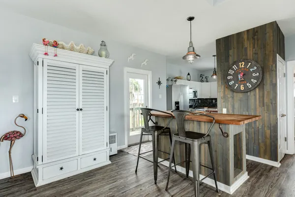 a kitchen with stainless steel appliances a sink stove and cabinets