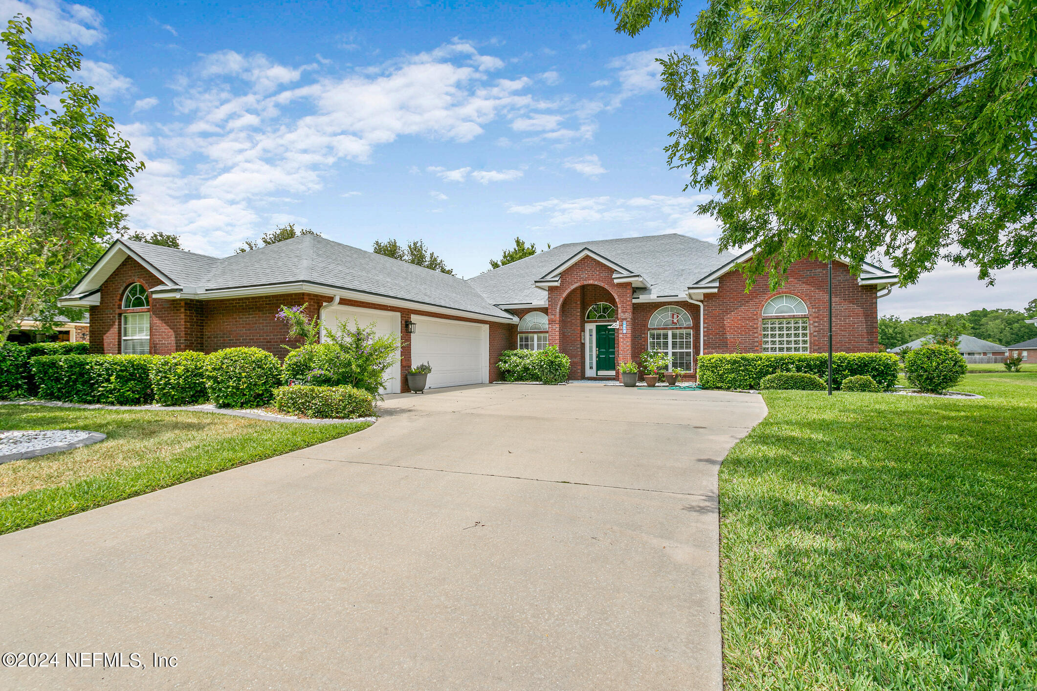 a front view of a house with yard