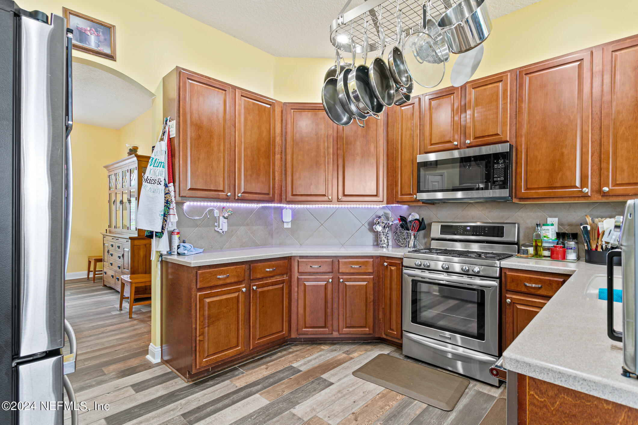 1658 Lockend Road Jacksonville, FL 32221 - Photo 15 of 54 a kitchen with stainless steel appliances granite countertop a stove a sink and a microwave