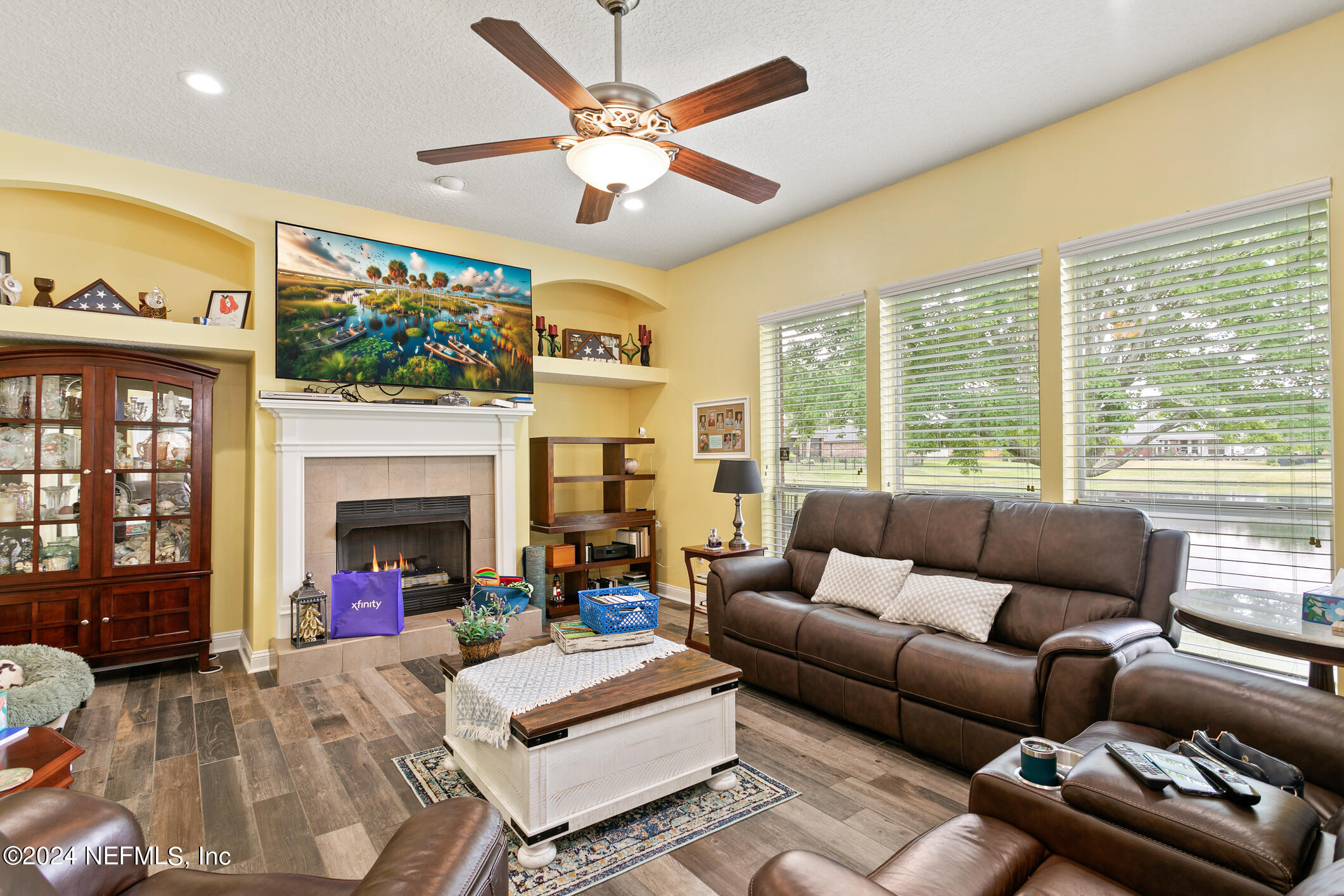 1658 Lockend Road Jacksonville, FL 32221 - Photo 21 of 54 a living room with furniture fireplace and a large window