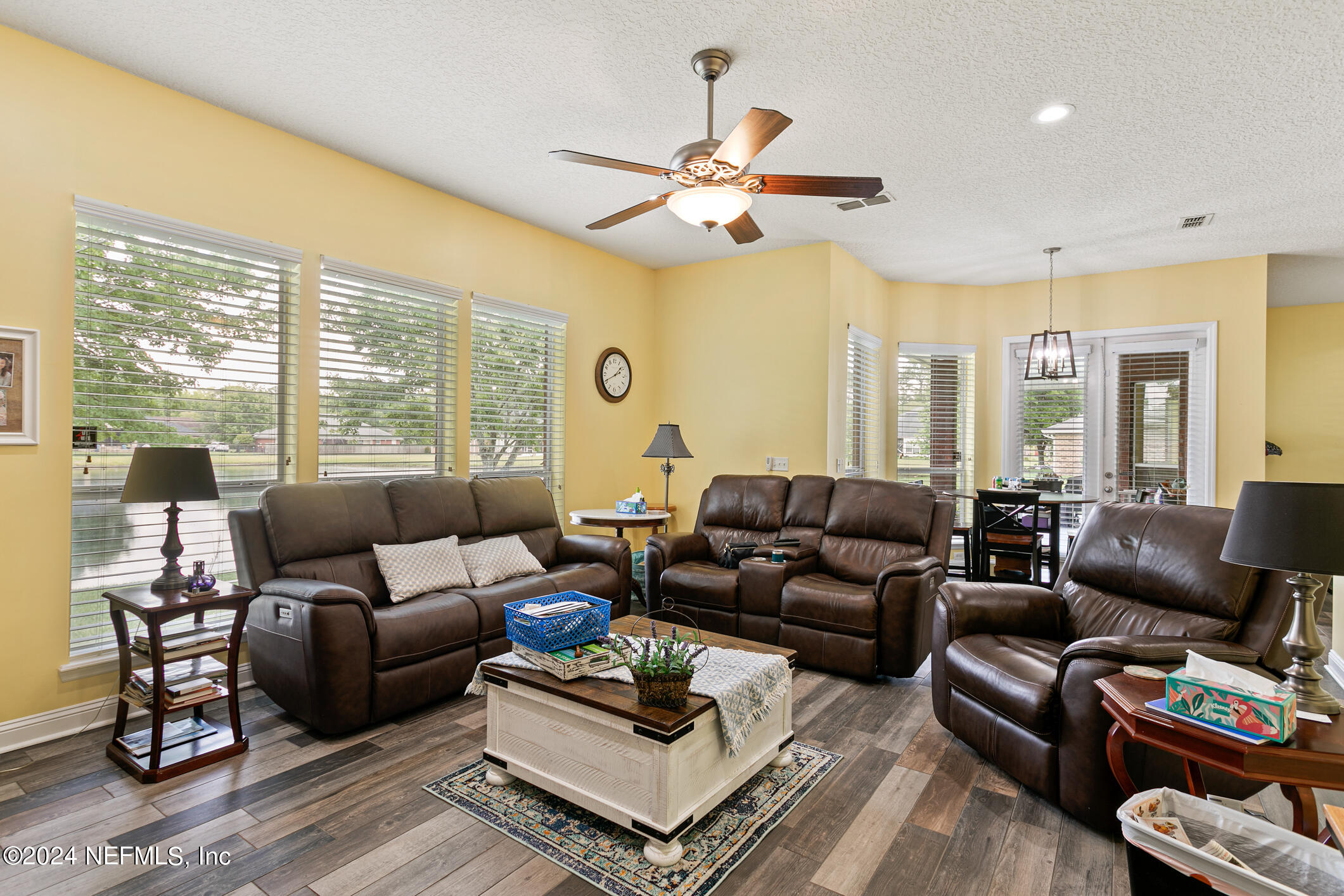 1658 Lockend Road Jacksonville, FL 32221 - Photo 22 of 54 a living room with furniture ceiling fan and a large window