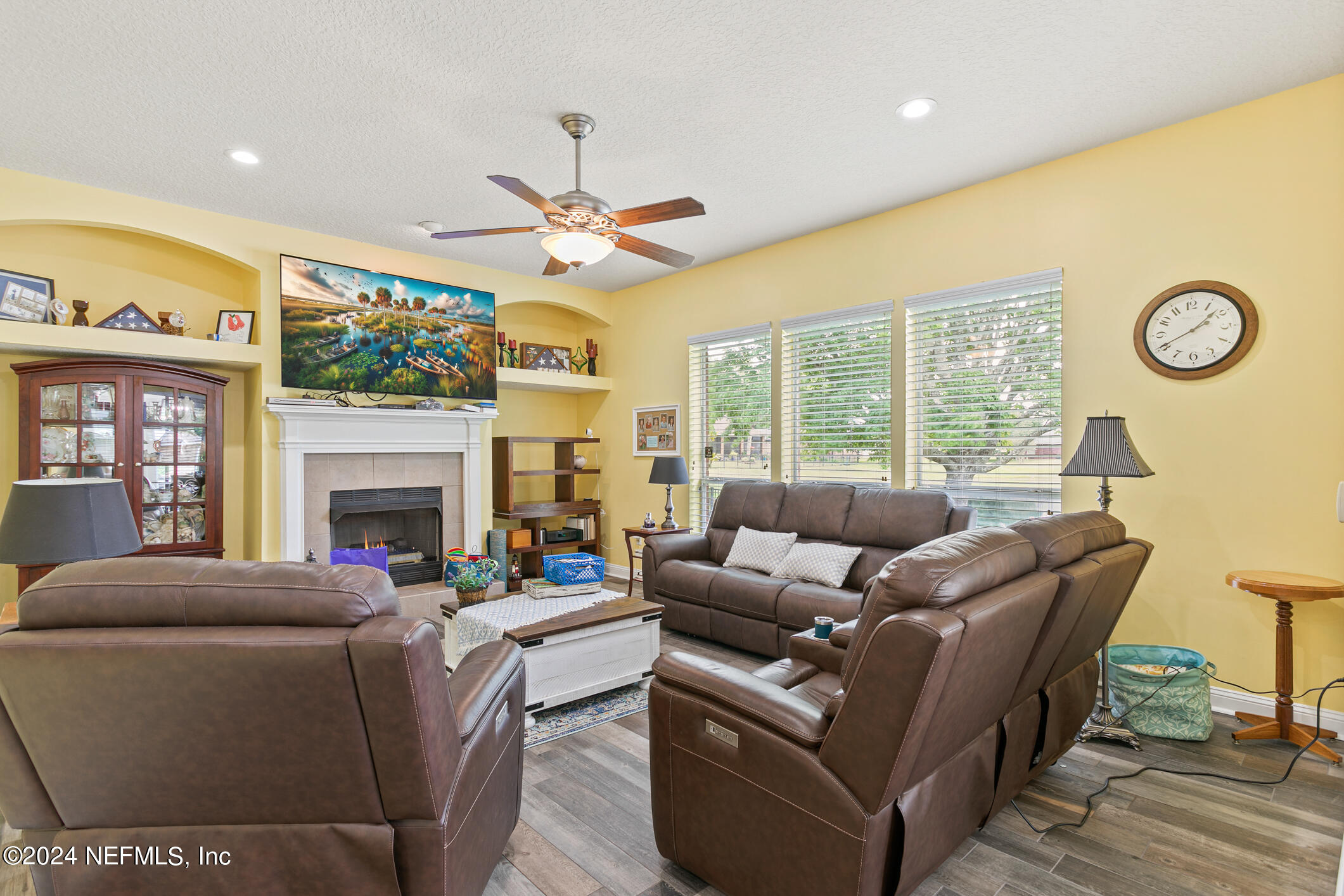 1658 Lockend Road Jacksonville, FL 32221 - Photo 23 of 54 a living room with furniture a fireplace and a flat screen tv