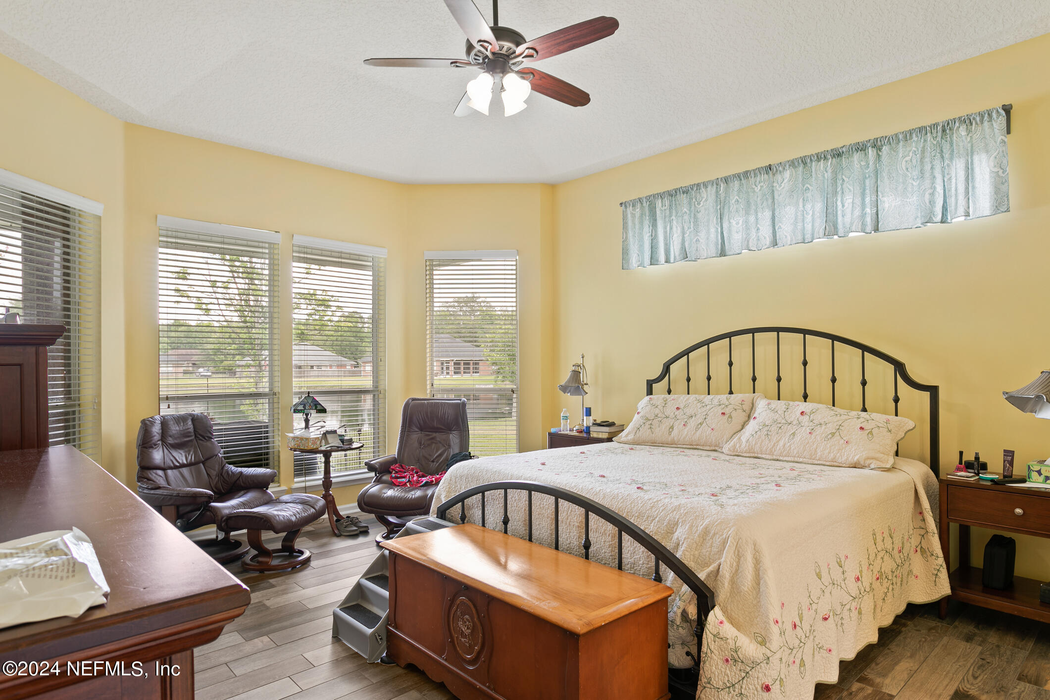 1658 Lockend Road Jacksonville, FL 32221 - Photo 27 of 54 a bedroom with a bed a couch and a large window