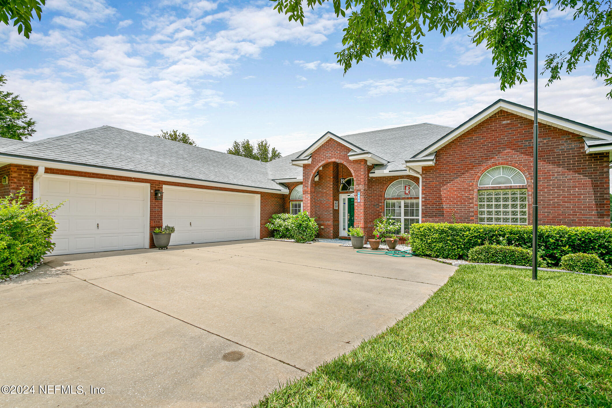 1658 Lockend Road Jacksonville, FL 32221 - Photo 3 of 54 front view of a house with a street