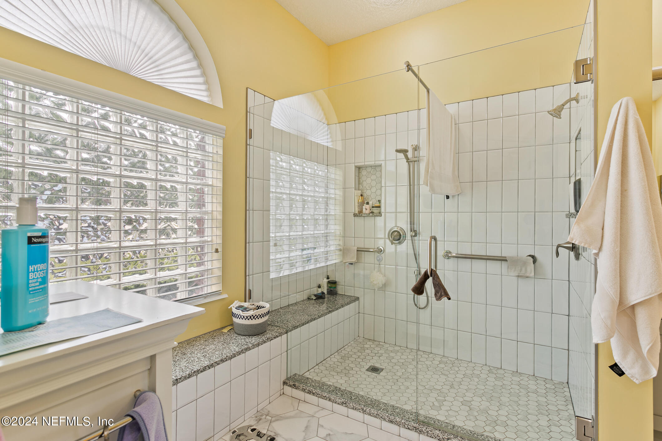 1658 Lockend Road Jacksonville, FL 32221 - Photo 31 of 54 a bathroom with a granite countertop sink a toilet and shower
