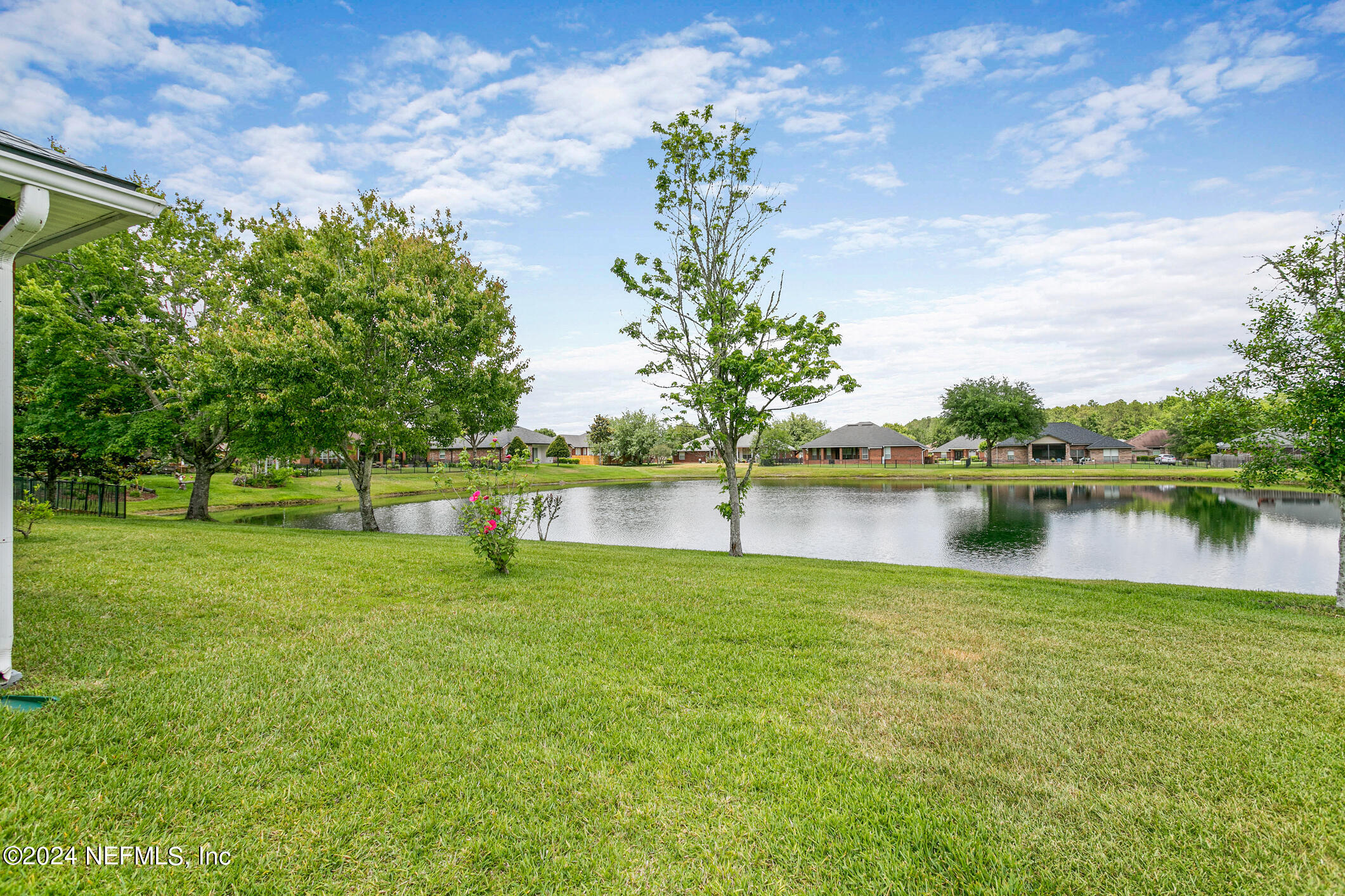1658 Lockend Road Jacksonville, FL 32221 - Photo 44 of 54 a view of a lake with a house in the background