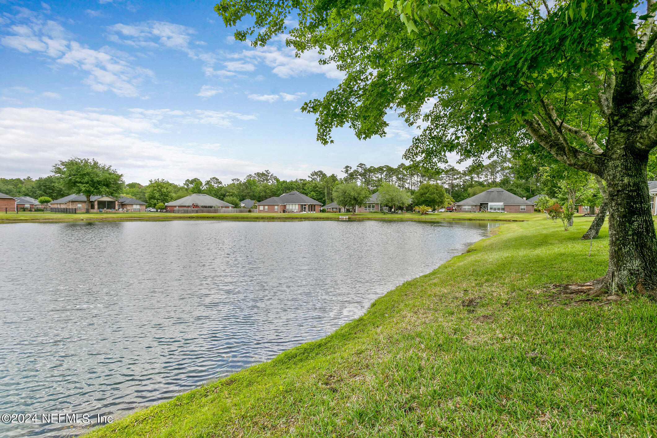 1658 Lockend Road Jacksonville, FL 32221 - Photo 46 of 54 a view of a lake with houses in the back
