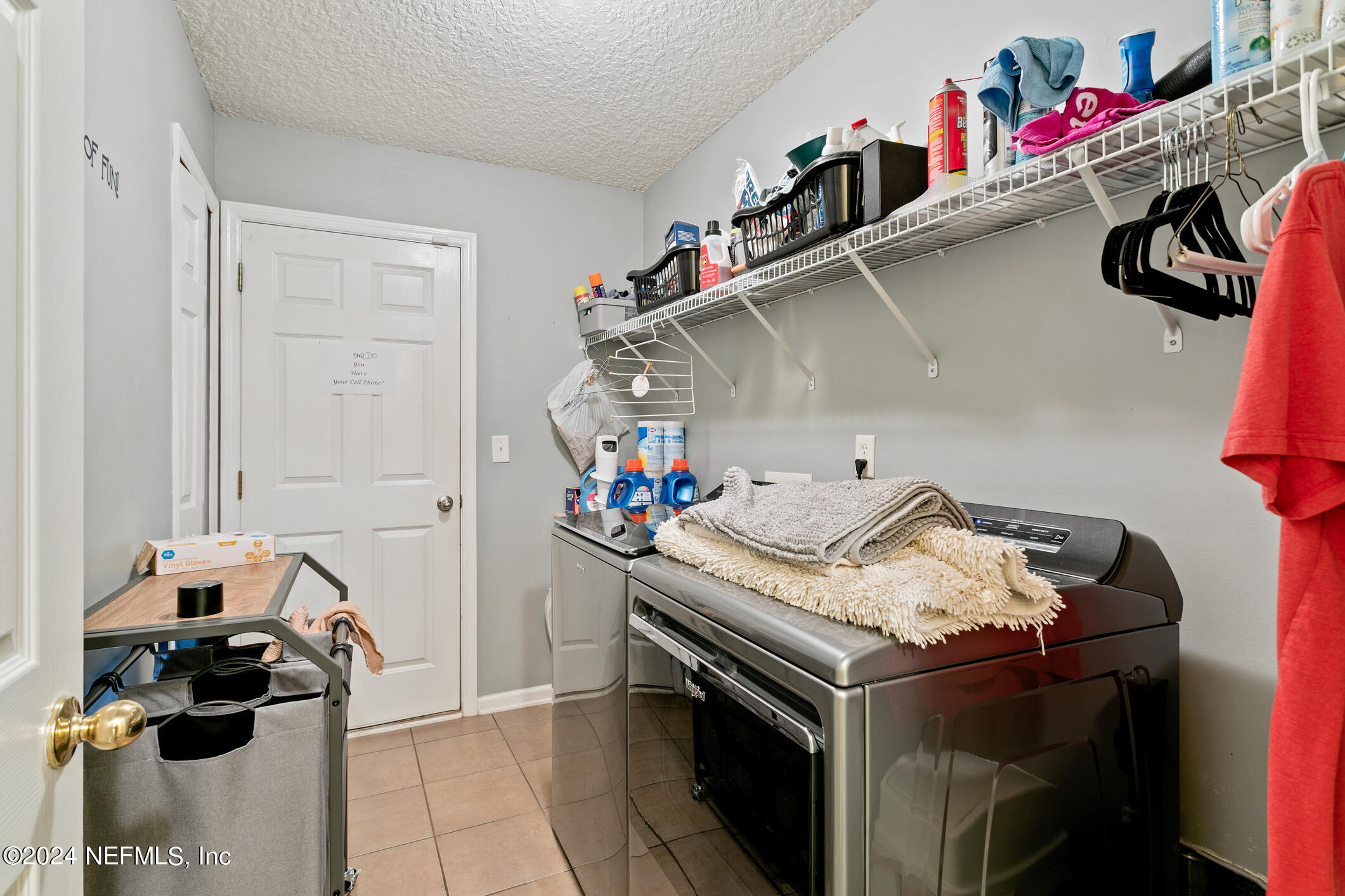 1658 Lockend Road Jacksonville, FL 32221 - Photo 9 of 54 a utility room with dryer and washer