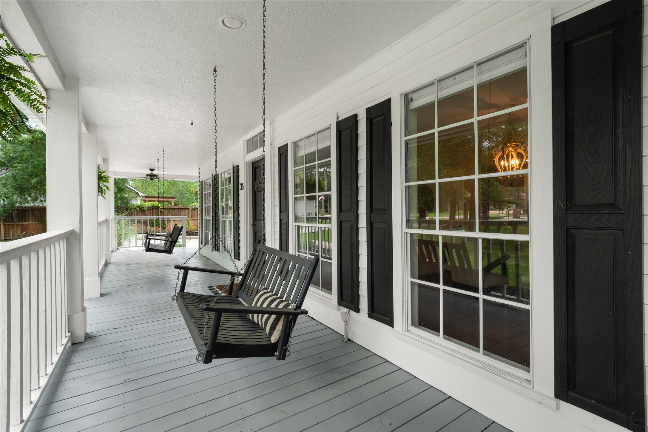 36 Wind River Drive Conroe, TX 77384 - Photo 9 of 45 Enjoy leisure time on this charming wrap around porch in the front of the home.
