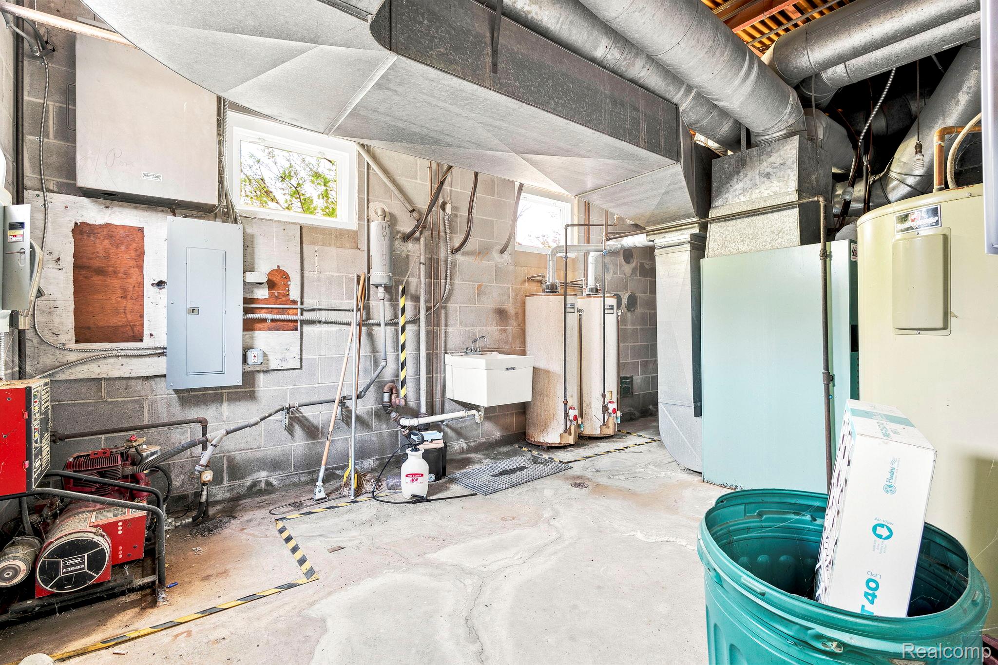 9735 Dolan Road Columbus, MI 48063 - Photo 56 of 63 Concrete block foundation with exposed ductwork and utility infrastructure