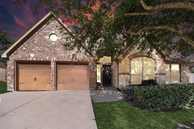a view of a dining room with furniture wooden floor and a chandelier