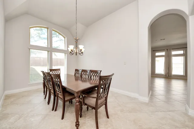 a kitchen with stainless steel appliances kitchen island granite countertop a stove and cabinets