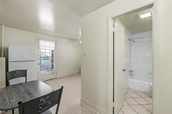 a view of kitchen with furniture and wooden floor