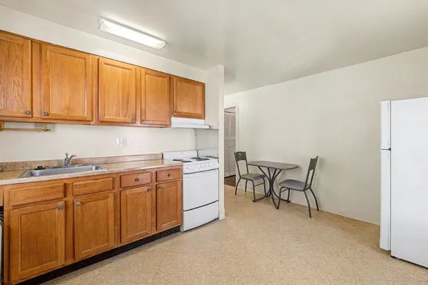 a kitchen with sink and cabinets