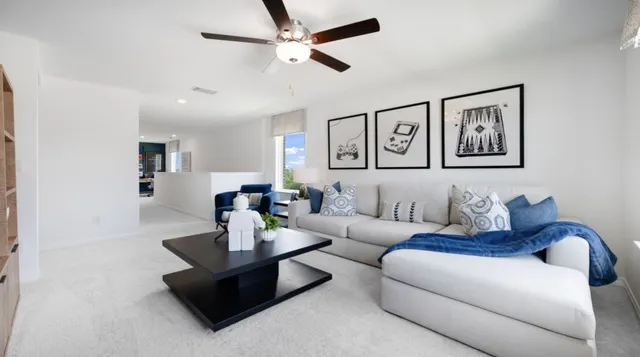 a view of a livingroom with furniture and windows